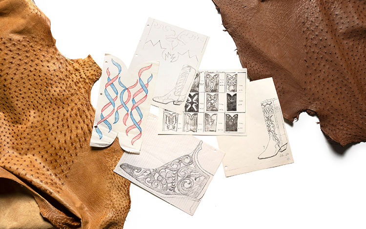 flatlay of sketches of cowboy boots and pieces of leather